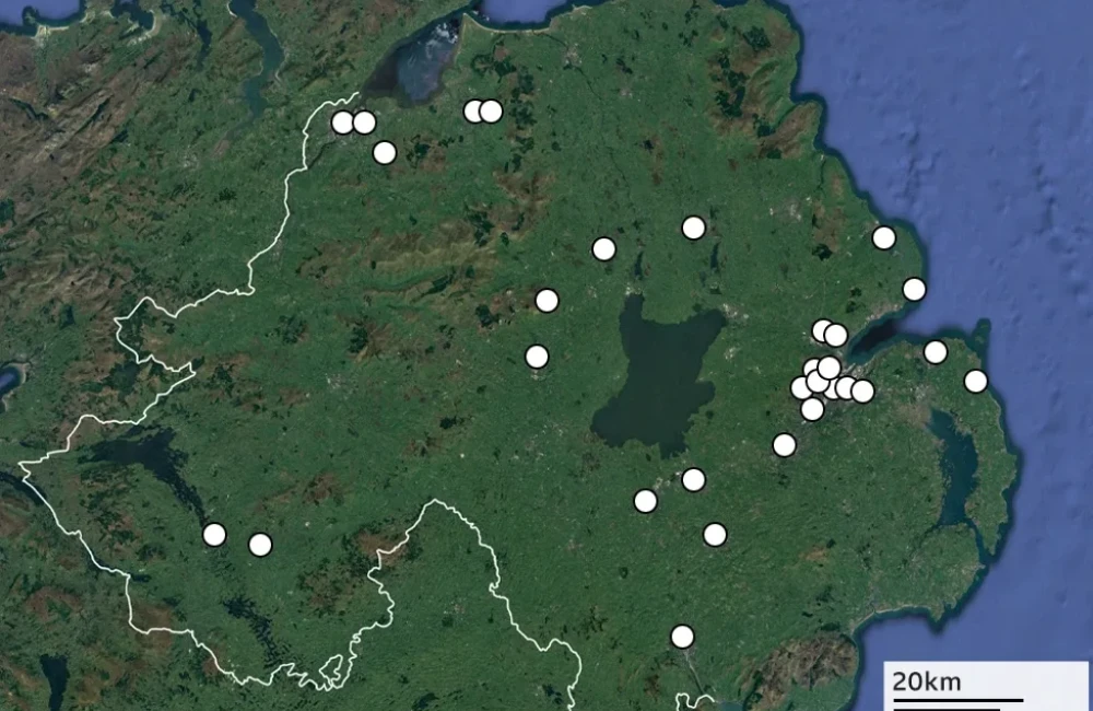 A map of Northern Ireland showing the location of 30 murders of women. The map is green with the locations highlighted by a white dot.