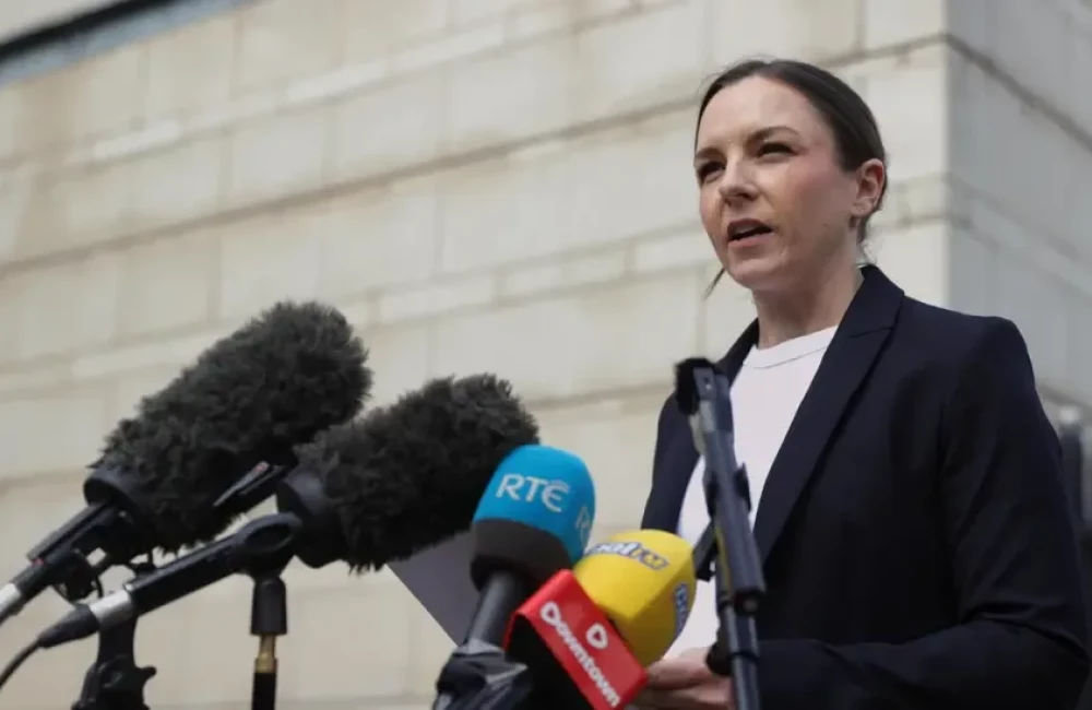Det Insp Kelly Foley, a woman with short, dark hair tied back from her face, addresses reporters outside the Laganside court complex in Belfast.  She is wearing a dark suit and a white crew-neck top.