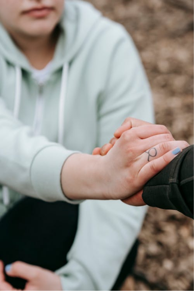 Two people clasping hands